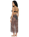 Model wearing a sheer leopard print beach cover-up with a wrap tie waist and side slit over black swimwear.