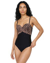 Model wearing a black and leopard print underwired one-piece swimsuit with adjustable straps and crossover bust detail
