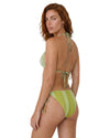 Model wearing an olive print triangle bikini set with halter ties and side tie bikini bottoms.