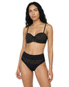 Model wearing a black high-waist bikini set with gold geometric print, structured bandeau-style top, and elegant retro-inspired silhouette.