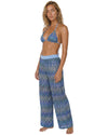 Model wearing blue chevron knit wide-leg cover-up pants with a lightweight semi-sheer shimmer fabric and elastic waistband.