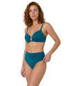 Woman wearing a teal high-waisted bikini set with adjustable straps, gold pineapple center detail