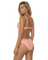 Model wearing a peach ruched bikini set with adjustable straps, molded cups, and matching low-rise bikini bottoms.