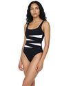 Woman wearing a black one-piece swimsuit with white contrast waist detailing