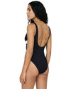 Woman wearing a black one-piece swimsuit with white contrast waist detailing.