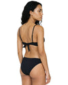 Woman wearing a black triangle bikini set with sparkling crystal embellishments and adjustable straps.
