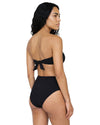 Woman wearing a black crystal embellished bandeau bikini set with twisted front top, tie-back closure, and high-waisted bikini bottoms