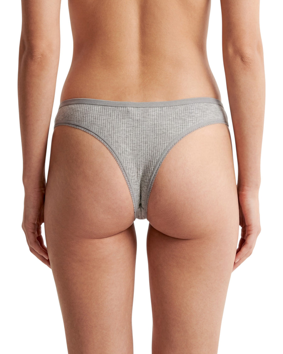 Women's grey ribbed cotton low-rise thong with delicate lace accents, soft stretch fabric, and minimal back coverage for everyday comfort.