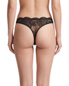 Women's black floral lace low-rise thong featuring sheer stretch lace, soft elastic edges, and minimal back coverage for a smooth, feminine fit.