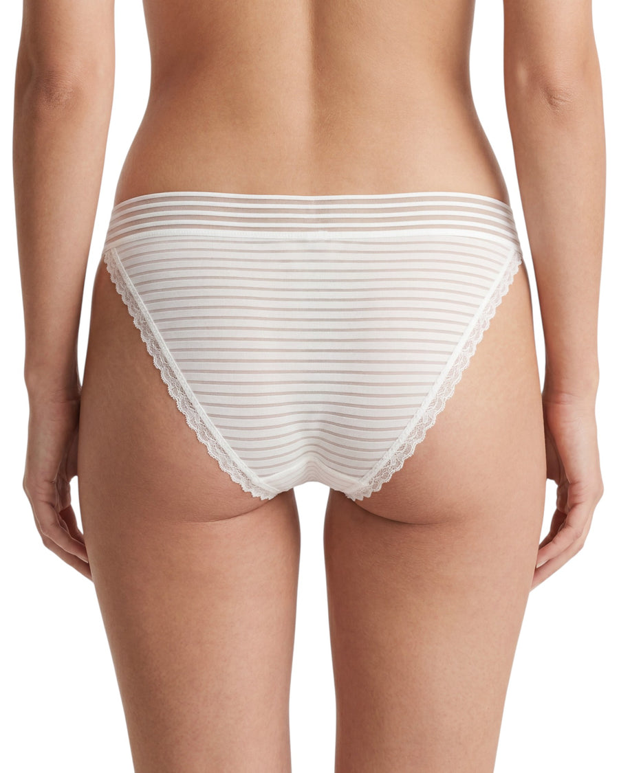 Women's white low-rise bikini brief featuring sheer striped mesh fabric, delicate lace-trimmed leg openings, and a lightweight, feminine design.