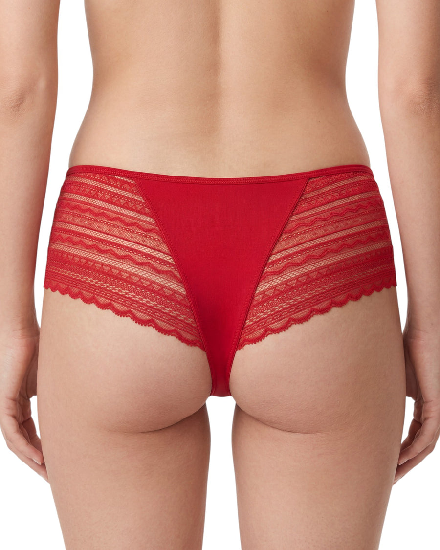 Women's red high-waist hipster brief featuring soft cotton front and back panels, sheer lace side inserts, scalloped lace edges, and a satin bow at the center front.