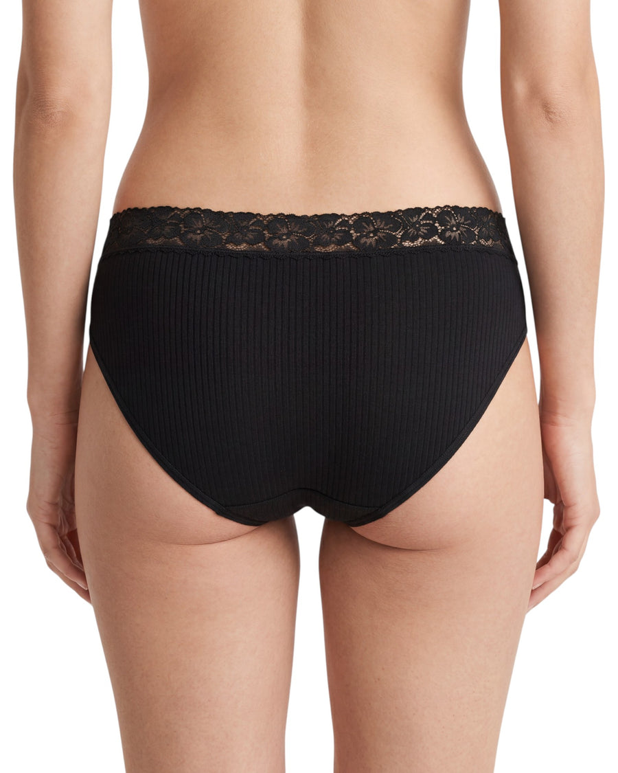 Women's black mid-rise cotton brief featuring a floral lace waistband, smooth cotton front panel, ribbed back fabric, and moderate back coverage.