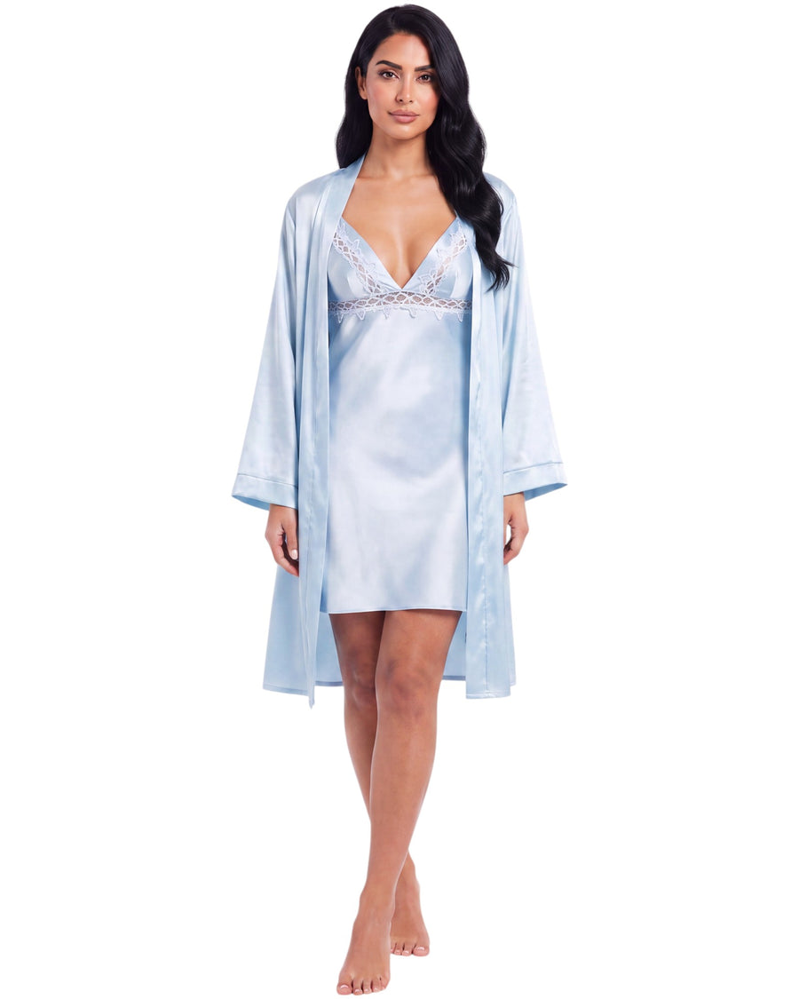 A woman modeling a light blue satin robe over a matching satin slip dress with lace trim