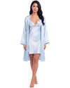 A woman modeling a light blue satin robe over a matching satin slip dress with lace trim