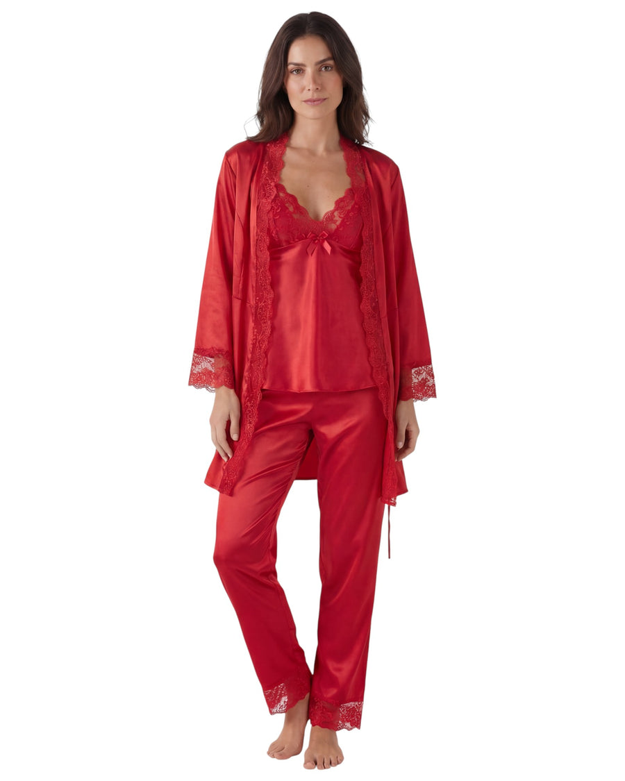 Woman wearing a red satin pajama set with matching robe 
