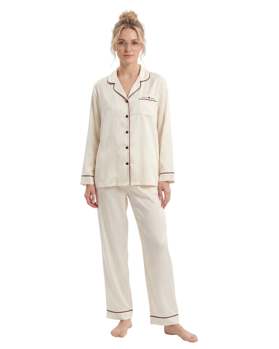 Woman wearing a satin ecru striped pajama set