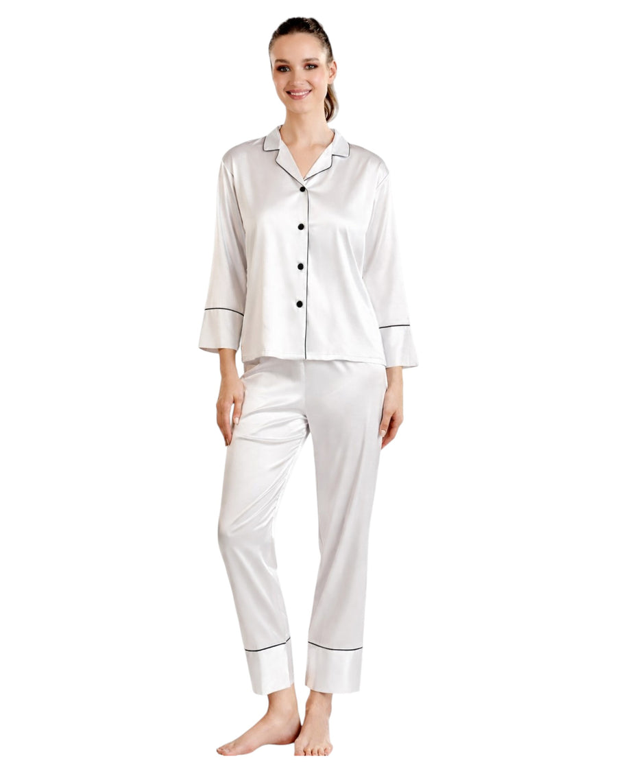 Woman wearing a white satin pajama set