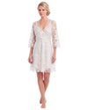 A woman modeling a short white lace robe with three-quarter sleeves and a V-neckline