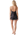 Black satin cami and shorts pajama set with contrast piping and adjustable straps.