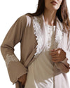 Woman wearing a beige loungewear set with lace details