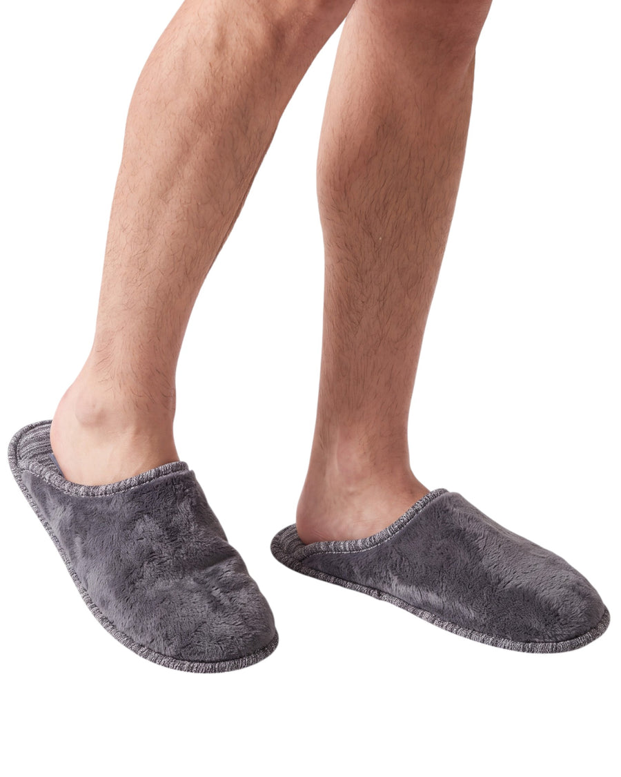 A pair of men's plush slip-on slippers in dark gray