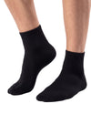 Men's black cotton quarter socks featuring a soft knitted texture, ribbed cuffs, and a comfortable fit for everyday wear.