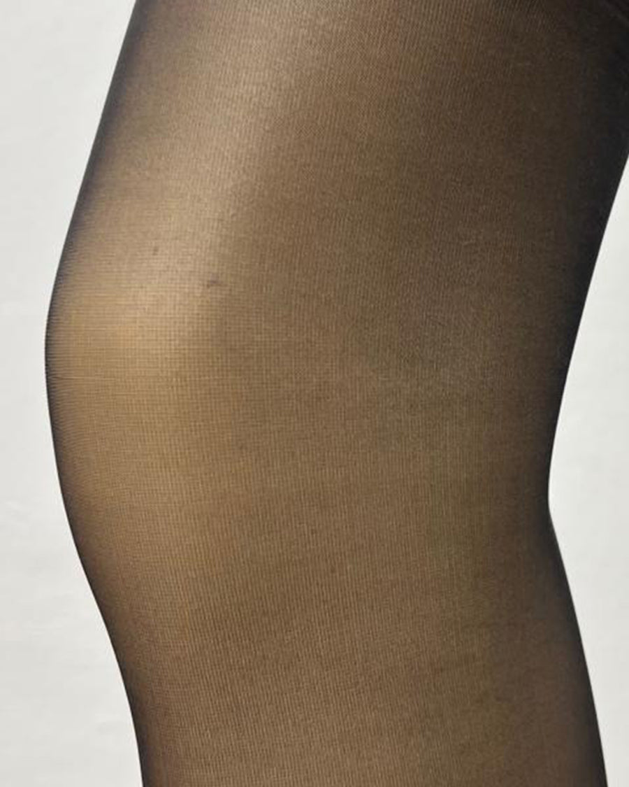 Detailed view of Eleva Shapewear Tights in black, emphasizing fine mesh and stretch. Ideal for sleek, supportive legwear styling.