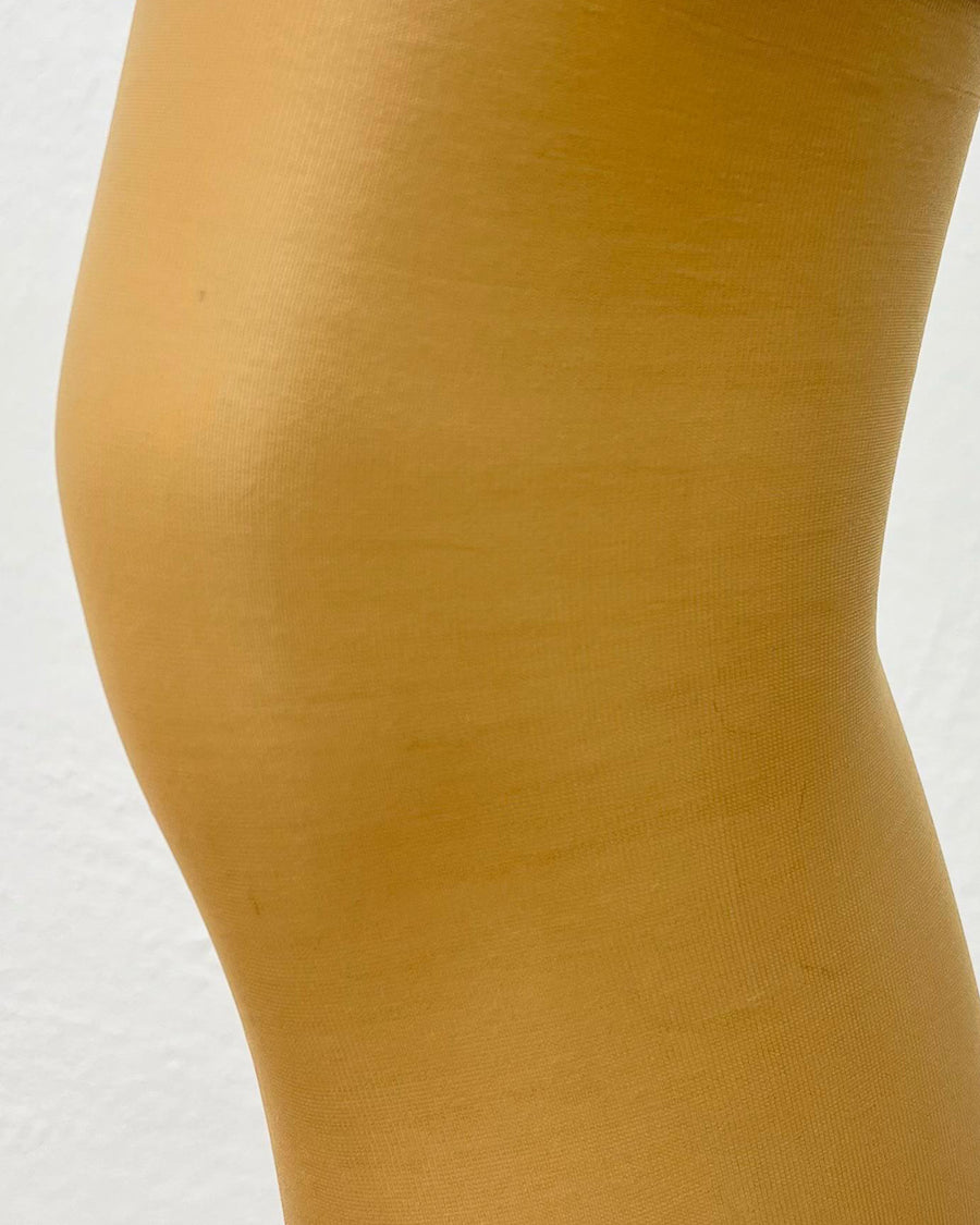 Detailed view of nude Altas Knee Highs 15Den tights with soft, sheer coverage. Shop Altas sheer tights for a flawless finish online.