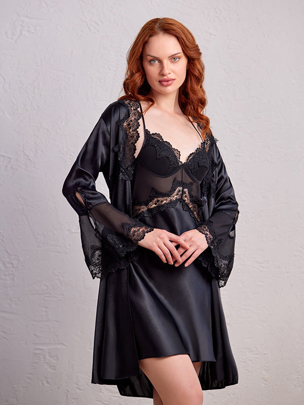 Model wearing a beautiful black satin babydoll robe with intricate embroidery on the hand laces